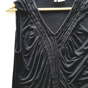 Ruched with tiny ruffles sleeveless top